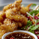 Pork Dumplings with Spicy Peanut Sauce